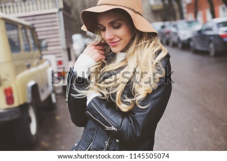 Similar – fashion autumn portrait of young happy woman walking outdoor