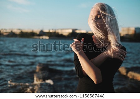 Similar – Image, Stock Photo Cool blonde woman performing dancing at sunset and raising the hand close to her head