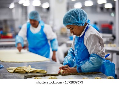 Lifestyle Reportage Photography Of A Pie And Pastry Wholesale Bakery Factory Workers Making Croissants By Hand