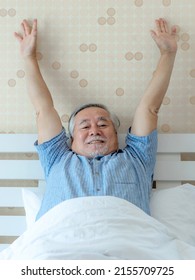 Lifestyle Senior Male , Asian old man feel happy good health wake up in the morning enjoying time in his home indoor bedroom background - lifestyle senior people happiness concept - Shutterstock ID 2155709725