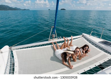 Lifestyle series: Group of Asian women on catamaran yacht