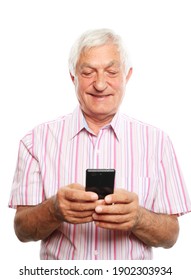 Lifestyle, Tehnology And Old People Concept: Happy Older Man Using Smartphone. Grandfather Typing Message For Grown Up Kids, Reading Sms With Good News, Shopping In Mobile App, Watching Photos.