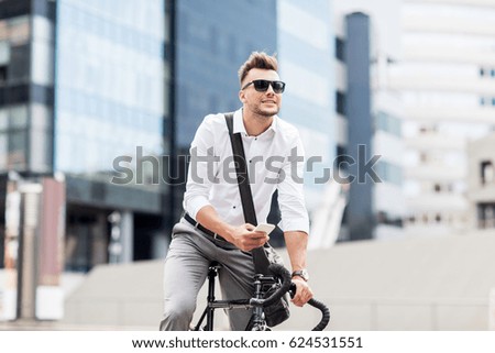 Similar – Image, Stock Photo Young man with bicycle in the sea