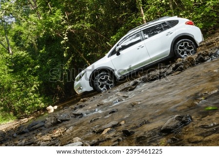 Lifestyle, travel on summer vacation with SUV 4wd adventure and exploration nature find scenery in forest, discovery white car drives into stream crossing river. Kaeng Krachan, Phetchaburi, Thailand Stock photo © 