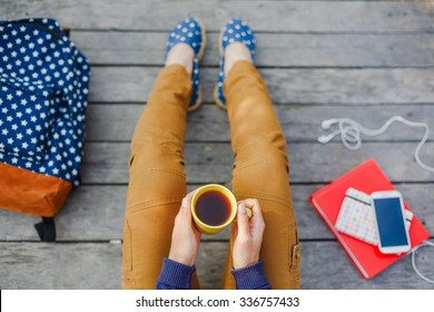 Lifestyle, Vacation, Education And People Concept. Young Hipster Girl Have A Tea Time Outdoor