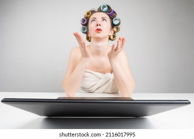 Lifestyle woman. Girl in curlers. Woman in towel. Housewife after taking shower. Funny female home scene. Self curling hair. woman waiting for curling hairstyle with curlers. Yourself hairstyle