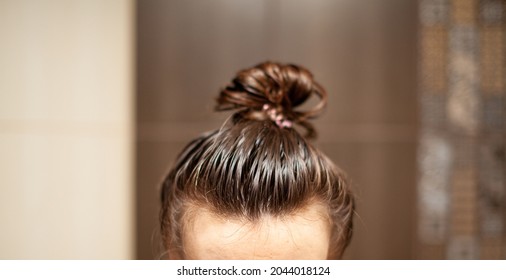 Lifestyle Woman Paints Henna Gray Hair, Hair Coloring Self-care. Hair Care At Home. The Woman Applied A Mask Or Balm To Her Hair.