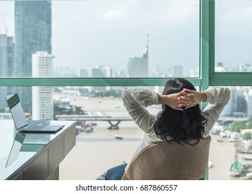 Life-work balance and carefree mental health concept with woman take it easy working and  resting in luxury business hotel at home office with computer pc laptop on desk