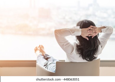 Life-work balance concept with woman take it easy or resting in hotel or home living room interior - Shutterstock ID 448063051