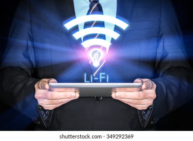 Li-Fi W-Lan technology, internet and networking concept - Young businessman activates Li-Fi High speed connection