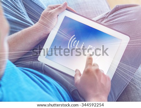 Li-Fi W-Lan technology, internet and networking concept - Young man activates Li-Fi High speed connection