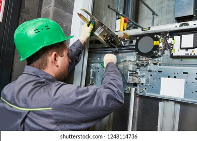 Lift Machinist Adjusting Elevator Mechanism