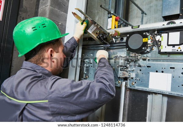 Lift Machinist Adjusting Elevator Mechanism Stock Photo 1248114736 ...