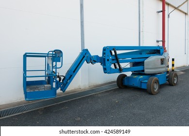 Lifting Boom Lift In Construction Site.