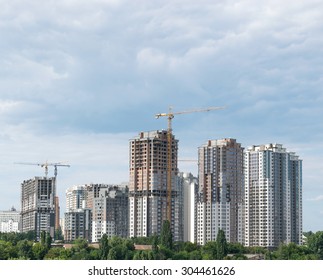 Lifting Cranes And Building Under Construction