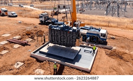 Lifting process for the assembly of electrical transformers in solar panel fields