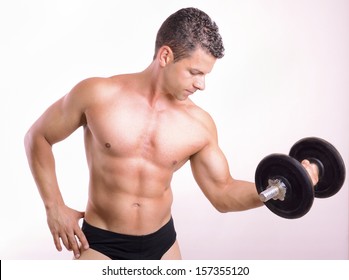 Lifting Weights Tough Guy On Gray Background