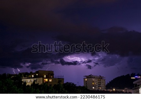 Lighning bolt over night sky in central Europe, Austria.