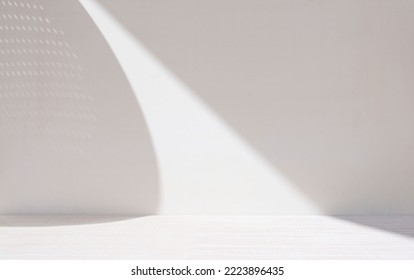 Light ackground image in gray tones with minimalist design of lights and shadows for product presentation or other creative purposes.