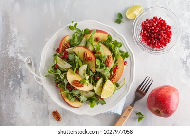 Light apple pecan pomegranate salad. Vegan  Food Concept. Top view, copy space