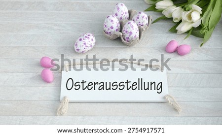A light background with Easter eggs and flowers; the words 
