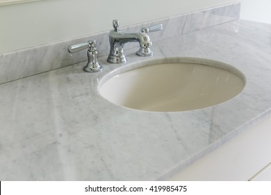 Light Bathroom With Marble Counter Top 