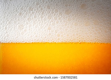 Light Beer With Bubbles And Foam Background. Beer Bubbles Texture Close Up