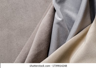 Light beige and grey colors velour textile samples. Fabric texture background