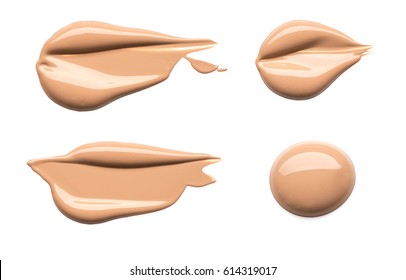 Light beige makeup smears of creamy foundation isolated on white background.