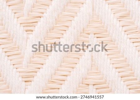 Light beige woven texture background, natural fabric pattern close up with copy space