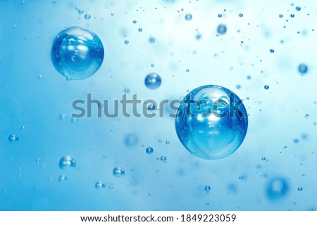 Light blue Air bubbles in alcohol gel. anti virus COVID-19 backdrop. Abstract background about cleanliness, shampoo bubbles, macro bubbles