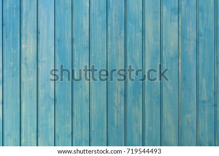 Light blue background of vertical boards. Smooth and clean tree background. Wooden texture. Background with soft pastel tones.