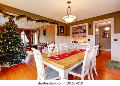 Light Blue Bedroom With Two Windows And Hardwood Floor. Furnished With Black Furniture Set