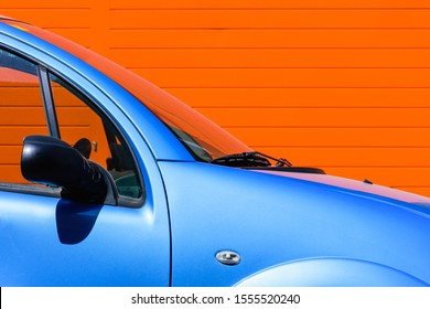 light blue car with yellow stripe