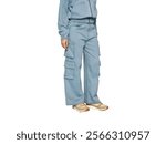 Light blue denim cargo pants with multiple front pockets, paired with neutral-toned sneakers, showcasing a casual and functional fashion style,