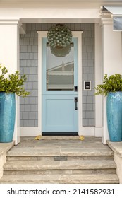 Light Blue Front Door With Steps.