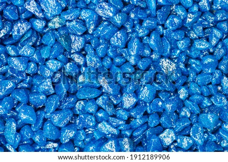 Light blue gemstone fake pattern. Blue glitter stones for garden decoration, flat lay, top view background.