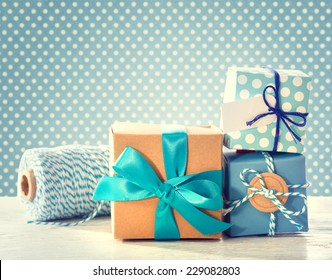 Light Blue Handmade Gift Boxes Over Polka Dots Background