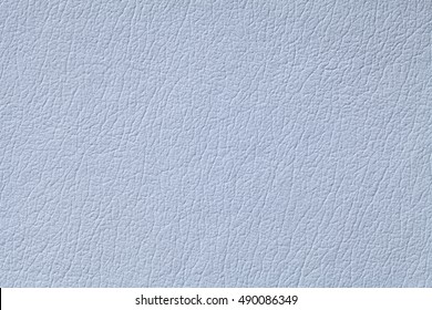 Light blue leather texture background with pattern, closeup.