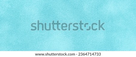 Light blue matte background of suede fabric, closeup. Velvet texture of seamless denim textile, macro. Structure of sky felt canvas backdrop.