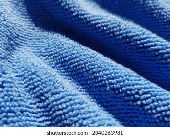 Light Blue Micro Fibre, In Diagonal Folds (texture).
