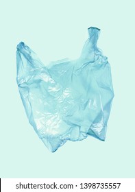 Light Blue Plastic Bag On Blue Background. Flying Package