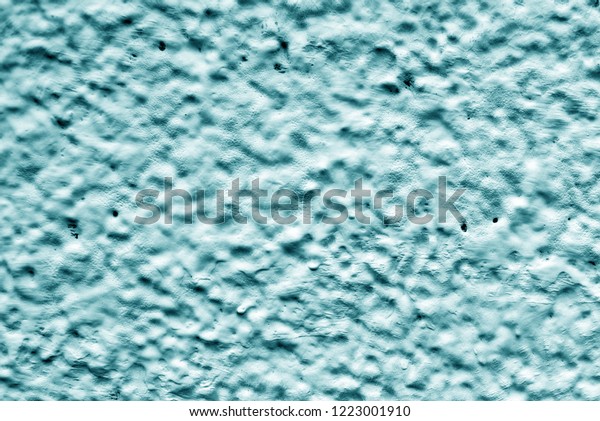 Light Blue
relief wall of the house. Dirty shabby wall with putty. Relief
paint of light blue color. The wall paint is like clouds and sky.
View of the mountains and craters of the
moon.