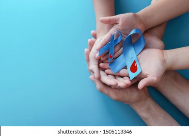 Light blue ribbons with blood on blue background , world diabetes day