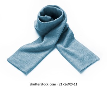 light blue scarf in soft wool rolled up on a white background
