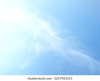 light blue sky background with white clouds drawn horizontally use as backdrop - Shutterstock ID 2257961411