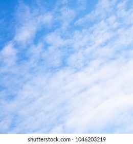 Light blue sky with clouds - background, space for your own text