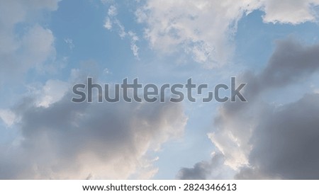 the light blue sky and grey clouds look so beautiful. Overcast sky. 
