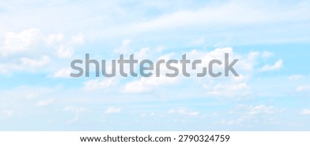 Light blue sky with weightless clouds. Sky only. 