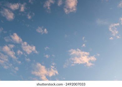 Light blue sky with white clouds. A backing of vanilla sky for publication, poster, screensaver, wallpaper, postcard, banner, cover, post. High quality photography